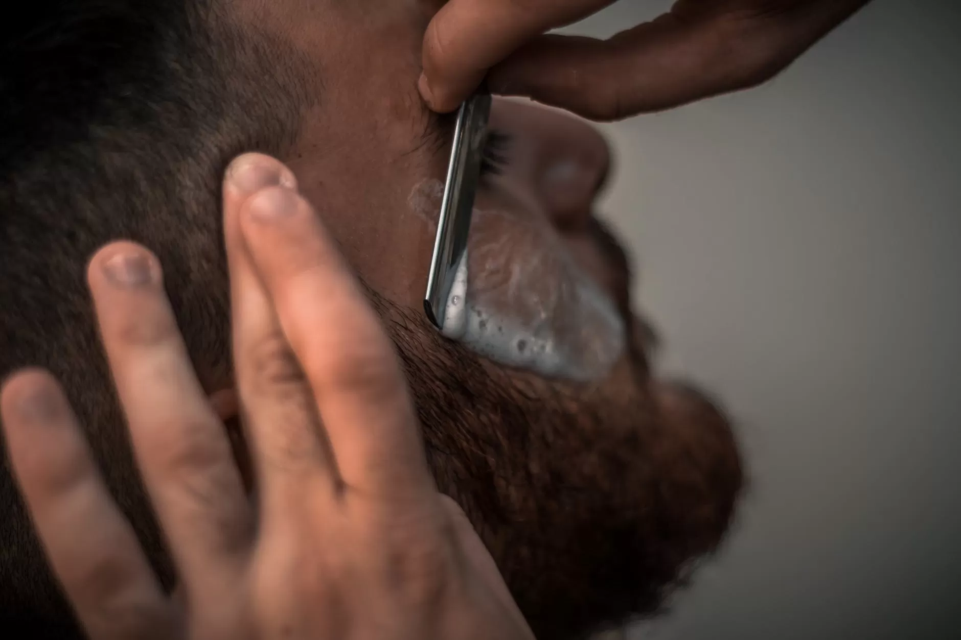 Barber at work in Hamilton East barbershop